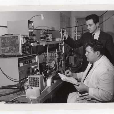 Chemistry professor, Ernest DiCarlo, working with graduate student in science laboratory, March 11, 1968.