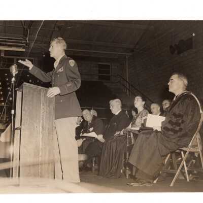 Interior view of Field House (Sports Complex) dedication with General Frank Howley, his wife, and others.