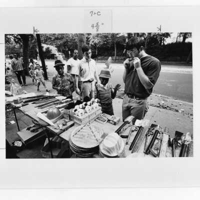 Students from "The House" or SJC Commune at 17th and Girard Streets, Philadelphia, with neighborhood children at street fair.