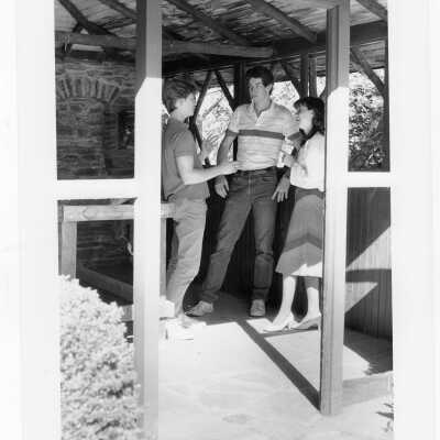 Students talking in old gazebo of Boland Hall.