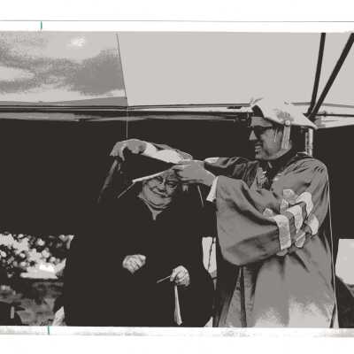 Donald I. MacLean, S.J., conferring honorary degree to Sister Elizabeth Carroll, R.S.M. during 1977 graduation/commencement.