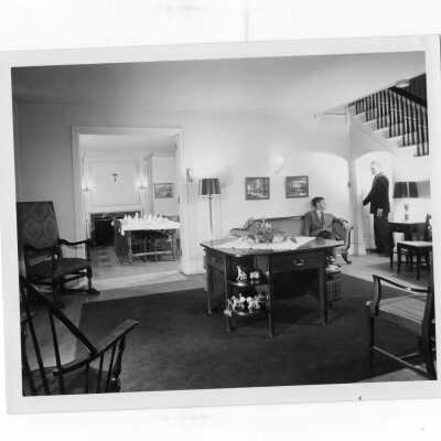 Interior of Simpson Hall with two students in living room taken for 1951 centenary edition of Crimson and Gray.