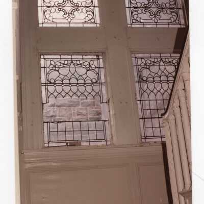Interior view of leaded windows in stairway of Wolfington Center (formerly Gest Estate, Neumann Hall).