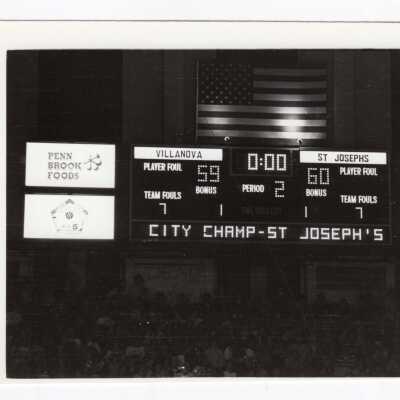 Men's Basketball game against Villanova. City Champs on scoreboard.