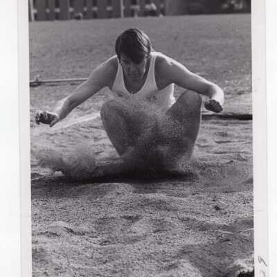 Men's track team member in long jump.