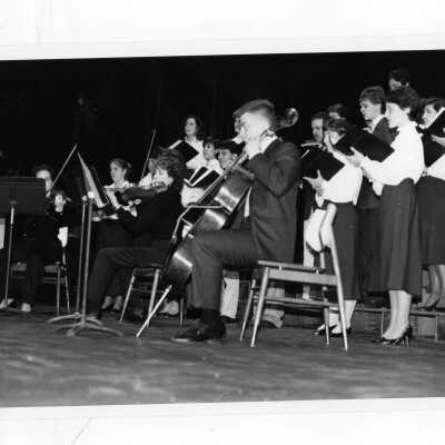 Glee Club and orchestra performing at Christmas concert.