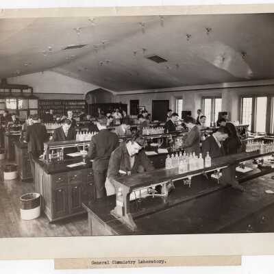 Students conducting science experiment in chemistry laboratory in Barbelin Hall, c. 1950.