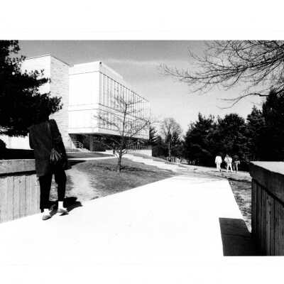 Students walking near new wing or addition to Drexel Library.