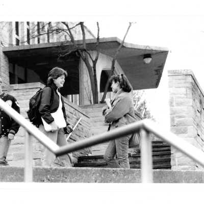 Students talking on steps near front entrance of Drexel Library.