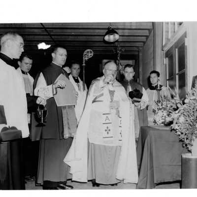 Interior view of Field House (Sports Complex) with Dennis Cardinal Dougherty and others.