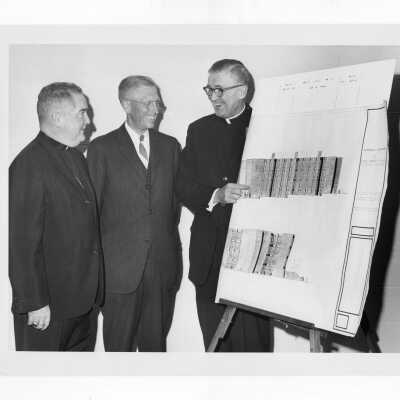 William F. Maloney, S.J. and others discussing plans for new science center.