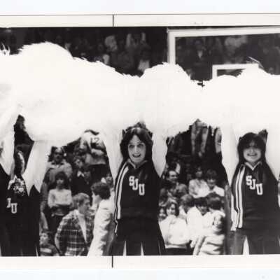 Women cheerleaders at basketball game.