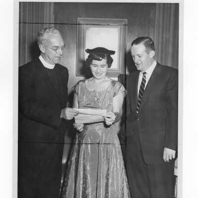 J. Joseph Bluett, S.J., with chairs of alumni association planning committee, Mrs. James Sullivan and Mr. James Mundy, c. 1960.