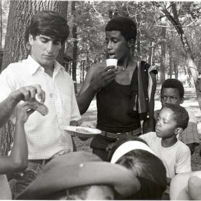Michael DiBerardinis and Joseph Daoust, S.J. (?) helping in recreation program as part of community service/outreach summer project in "The House" or SJC Commune at 17th and Girard Streets, Philadelphia.