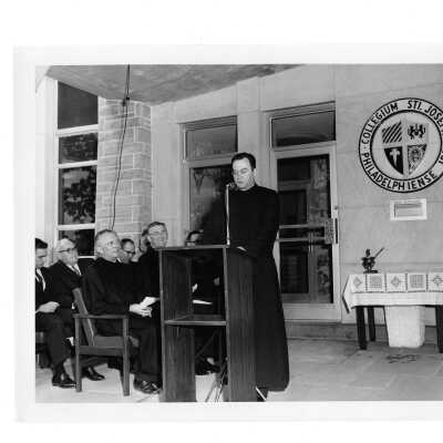 Dedication of new Drexel Library at front entrance with Father Leary (?), William F. Maloney, S.J., Matthew Sullivan, S.J. and others.