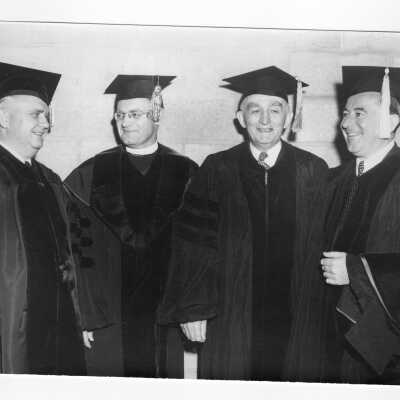 Edward G. Jacklin, S.J., with three honorary degree recipients, U.S. Representative William J. Green, Jr., George A Bennett, Joseph C. O'Mahoney during 1951 graduation/commencement. (Three black and white prints.)