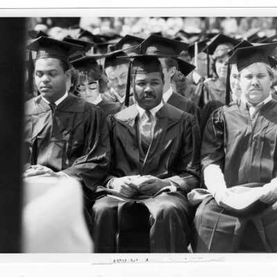Views of small groups of students during 1985 graduation/commencement on Gest Lawn.
