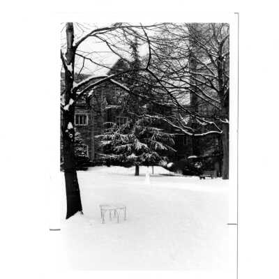 View of Regis Hall with snow on ground.