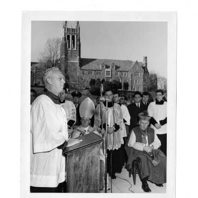 Bellarmine dedication with Barbelin building in background with J. Joseph Bluett, S.J., Bishop McShea, and others.