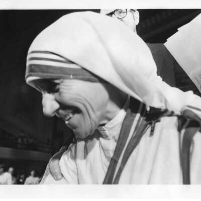 Mother Teresa at bread breaking ceremony during International Eucharistic Congress, symposium on hunger, August 2, 1976, held at Philadelphia Civic Center.