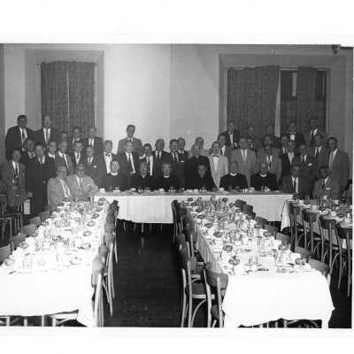 Alumni reunion of class of 1931, held June 1956. View of alumni group prior to eating dinner and includes Edward G. Jacklin, S.J., and Joseph S. Hogan, S.J.