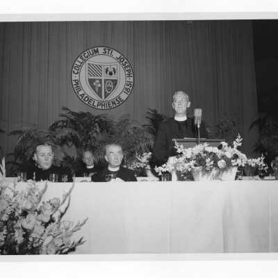 Testimonial dinner for Joseph S. Hogan, S.J., with J. Joseph Bluett, and Bishop Joseph McShea, May 26, 1957.