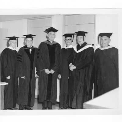 William F. Maloney, S.J., with dignitaries, possibly Golden Hawks from class of 1913, (Norbert A. Considine, Paul Esling) and Aloysius Tarvers, S.J. during 1963 graduation/commencement.