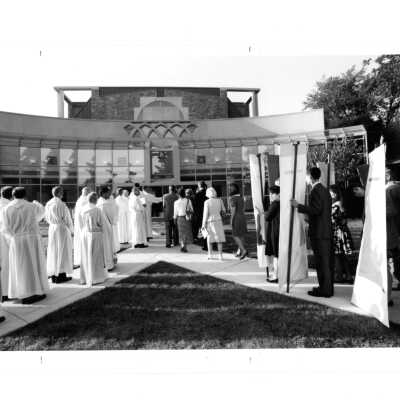 People walking into Chapel of Saint Joseph during dedication service.