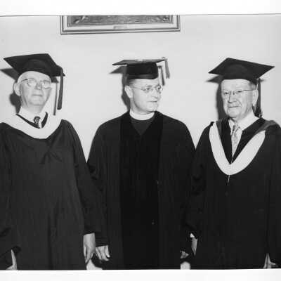 Edward G. Jacklin, S.J., with two golden hawks from the class of 1903, William F.X. Geoghan and Francis J. McIntyre at 1953 graduation/commencement ceremony.