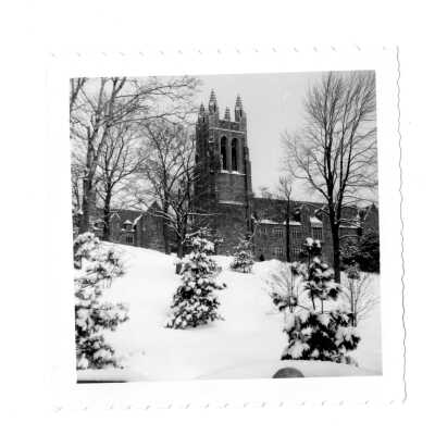 Exterior view of Barbelin Tower with snow on the ground.