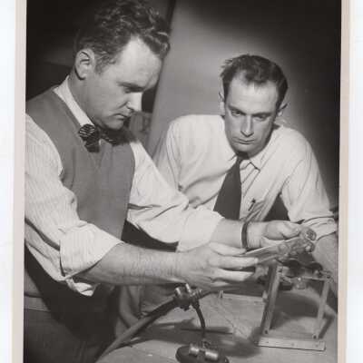 Two chemistry students conducting experiment, c. 1952.