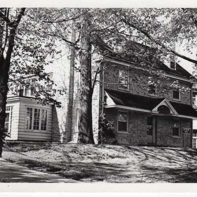 Exterior view of Overbrook House with sign in front giving name (now Barry Hall/Barry Annex?)