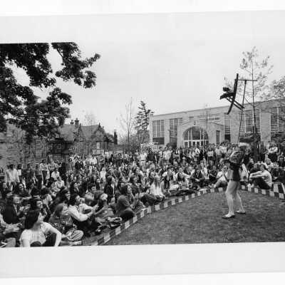 Students watching performance of Royal Lichtenstein Circus in front of Campion. (Clown/ringmaster in photo may be named Webb and may have once been a member of the Society of Jesus.)