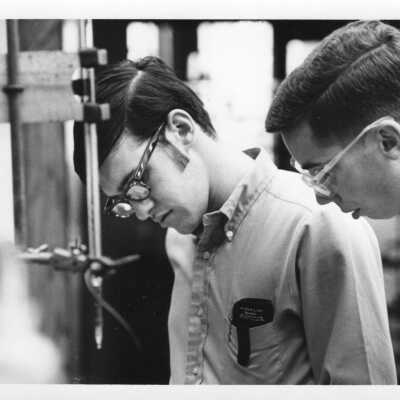 Chemistry students in Evening Division working on experiment in science laboratory, c. 1965.