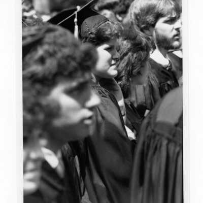 Views of small groups of students during 1985 graduation/commencement on Gest Lawn.