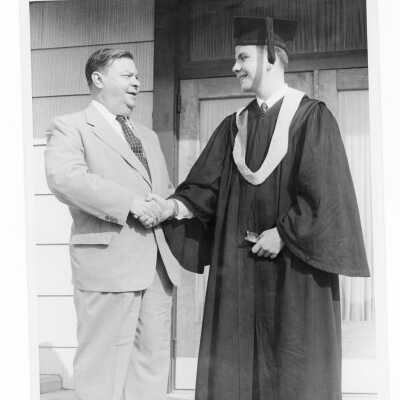 Graduating student, Maurice John Ward, Jr., with his alumnus father, Dr. Maurice J. Ward, Sr., class of 1927, during 1955 graduation/commencement ceremony.