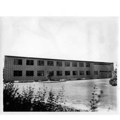 Exterior rear view of veterans barracks located near Cardboard College (also known as Barbelin Annex).