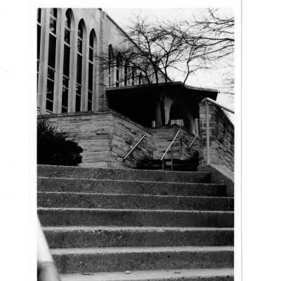 Exterior view of front entrance of Drexel Library from side steps.