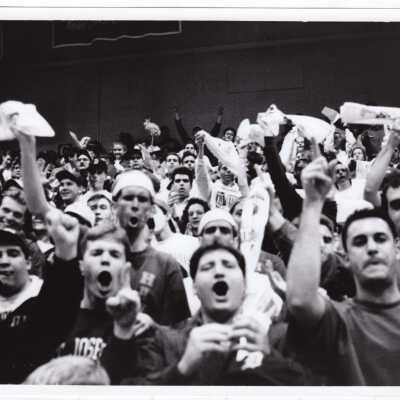Students cheering at Men's Basketball game