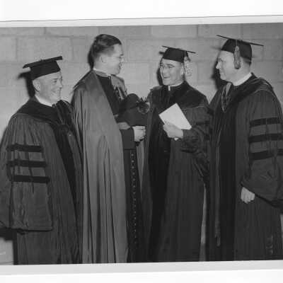John J. Long, S.J. with honorary degree recipients as part of 1949 graduation/commencement ceremony. Other individuals include Joseph Breen, Monsignor Fury, and Father Cox.