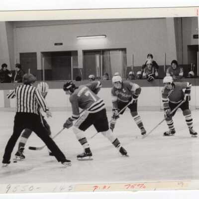 Men's ice hockey team in game.
