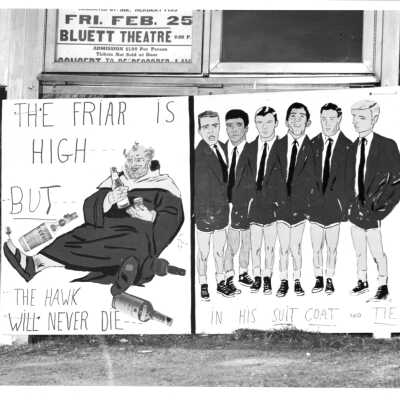 Student booster club (?) poster stating "The Friar is High but the Hawk Will Never Die in His Suit Coat and Tie" as part of pep rally event (?)