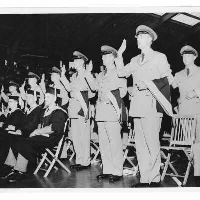 Commissioning of Air Force ROTC graduates during 1956 graduation/commencement ceremony in Field House.
