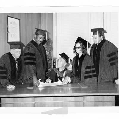 Terrence Toland, S.J., with four honorary degree recipients, Violette de Mazia, Alan D. Ameche, Marcus A. Foster, and Max M. Leon dring September 1970 graduation/commencement.