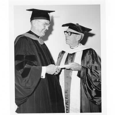 William F. Maloney, S.J., with honorary degree recipient Bishop Fred Pierce Corson, during October 1963 graduation/commencement.