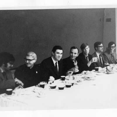 Members of Alpha Sigma Nu Honor Society attending dinner with Terrence Toland, S.J. and others.