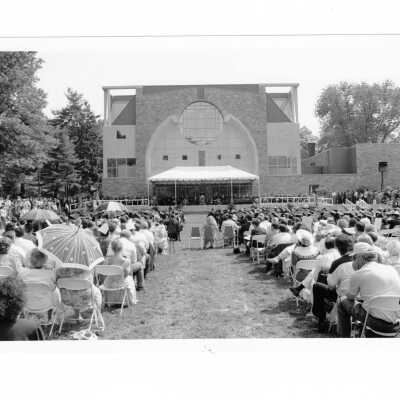 View of 1993 graduation/commencement ceremony on Gest Lawn with chapel in background.