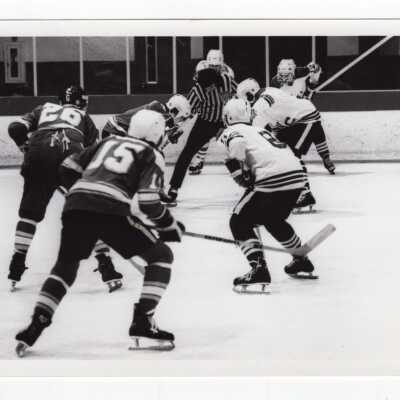 Men's ice hockey team in game.