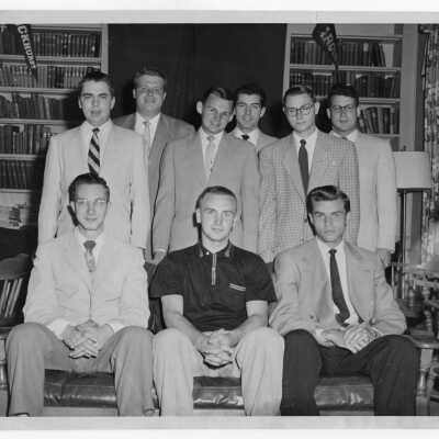 Group photo of student residents of Quirk Hall, most in coat and tie.