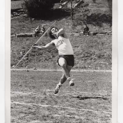 Men's track team member in javelin event.